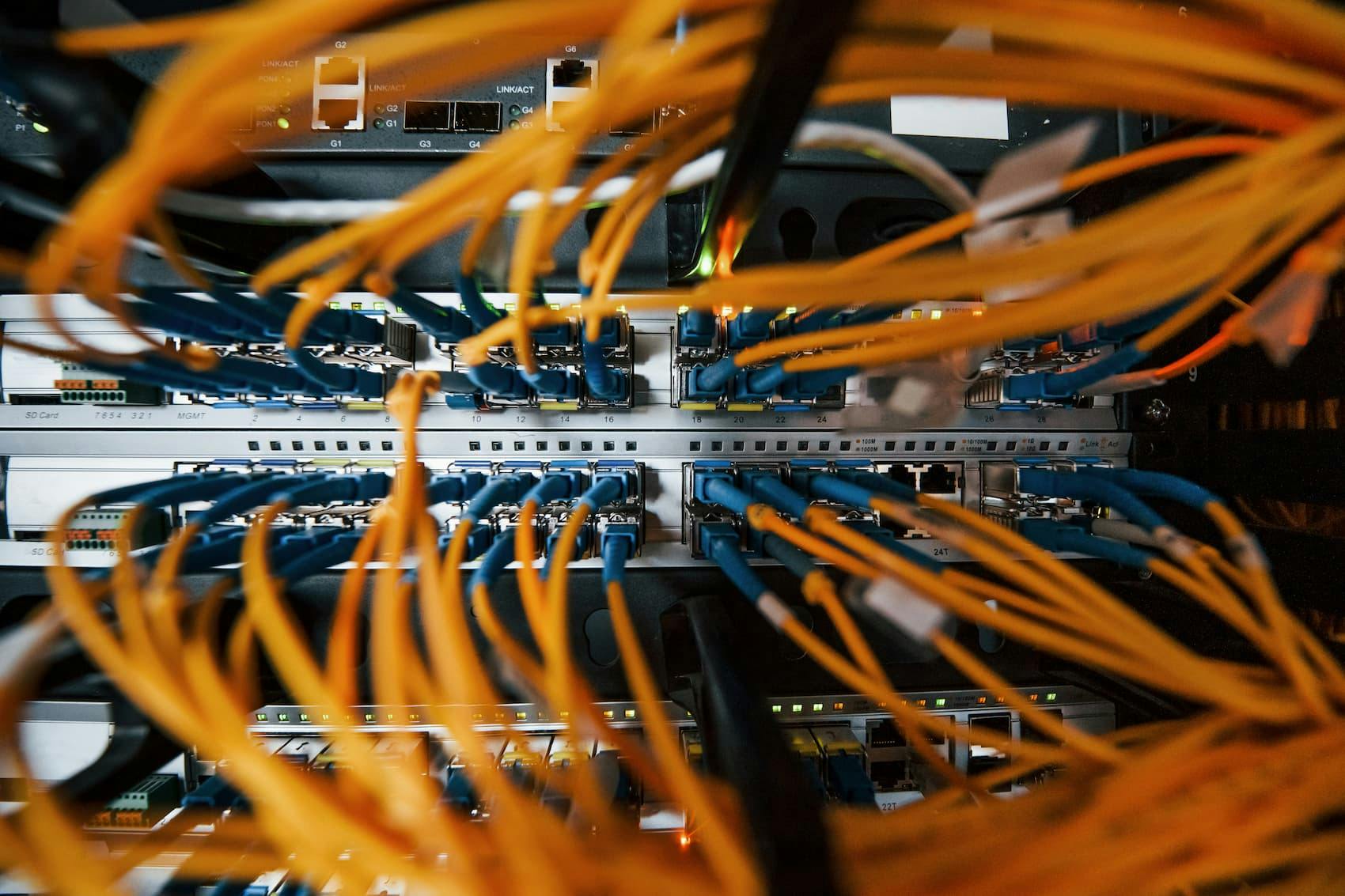 Network switch and fibre optic cables providing the backbone for VPS hosting services.
