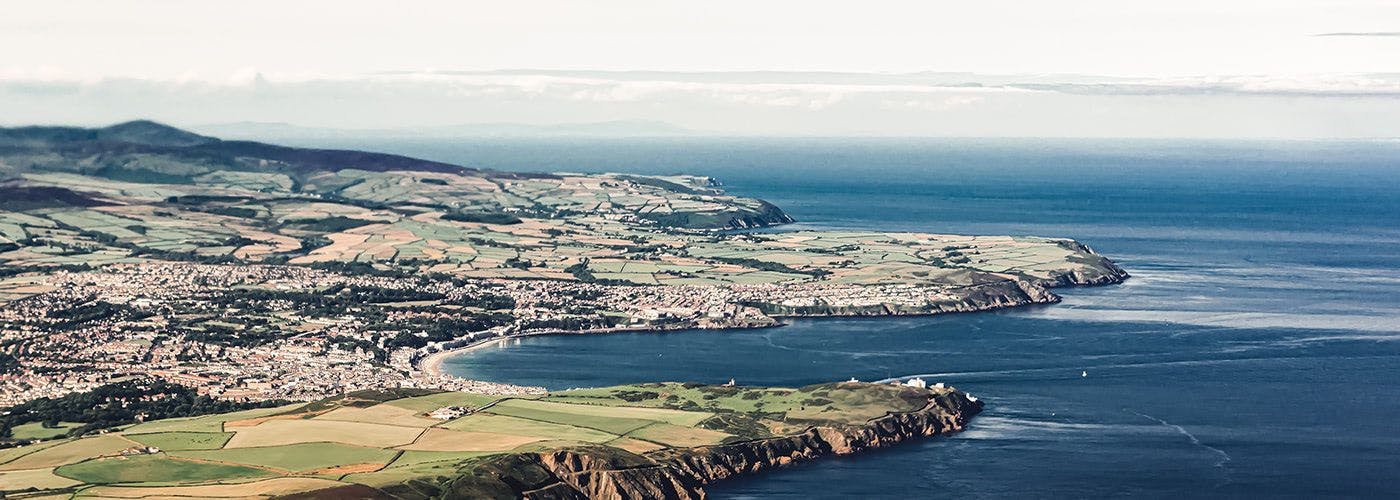 Aerial view of Ballasalla near The Dataport on the Isle of Man, blending natural beauty with cutting-edge VPS hosting facilities