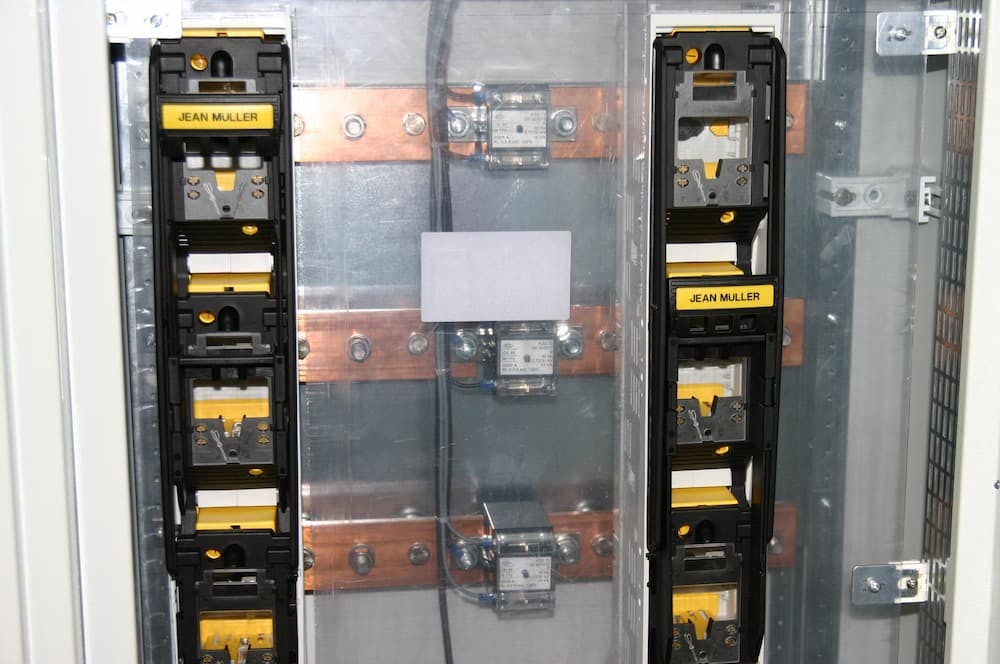 Electricity breakers labeled 'Jean Muller' for maintaining hight voltage safety