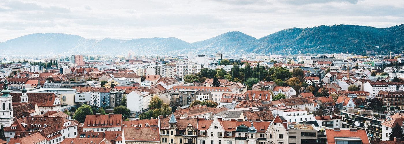 Aerial view of Graz, Austria, showcasing the picturesque urban landscape, home to state-of-the-art VPS hosting services.