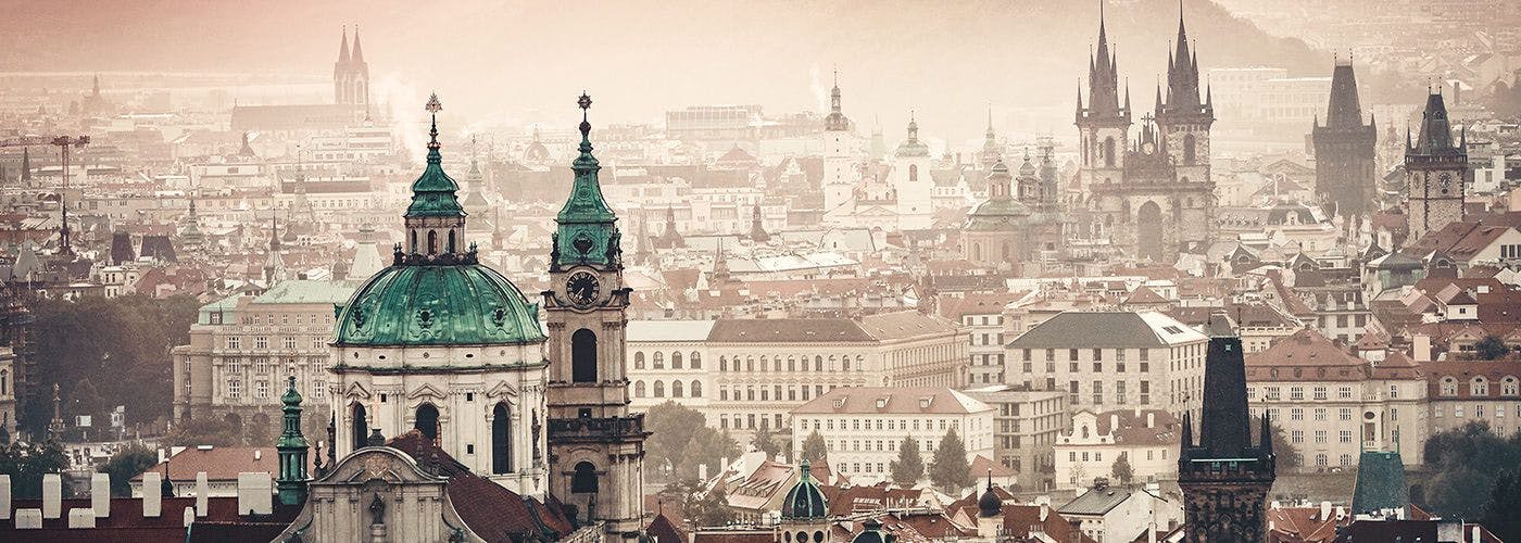Hazy cityscape of Prague in the Czech Republic, symbolizing the blend of historical charm and modern VPS hosting technology